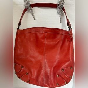 GOJI BRICK RED GENUINE LEATHER HOBO BAG. BRASS HARDWARE, RED ZIP.